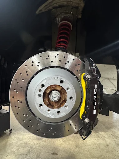 Porsche brake rotor and caliper with coilover suspension